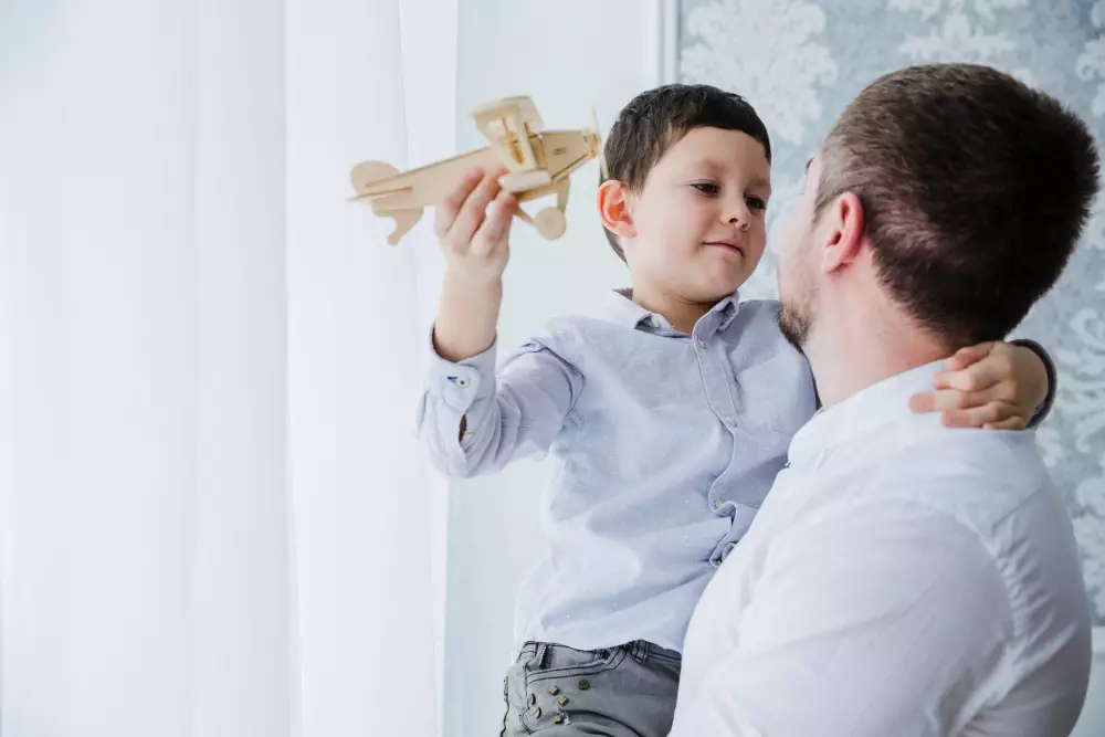 father son playing together fathers day